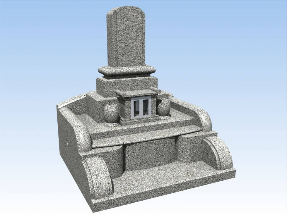 青空の下の立派な石のお墓
